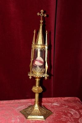 Reliquary - Relic Ex Ossibus St. Antonii De Liatoris ? With Original Document style Gothic - style en Bronze / Gilt / Glass Cillinder, Spain 19th century ( anno 1860 )