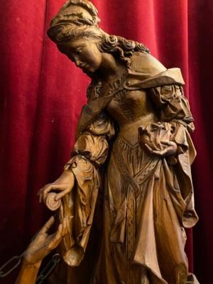 Wood Carved Statue Of Saint Elizabeth Giving A Coin With Her Right Hand To The Left Hand Of Beggar As Charity Gesture style Gothic - style en Hand - Carved Wood , Ortisei Sud Tirol Italy  20th century