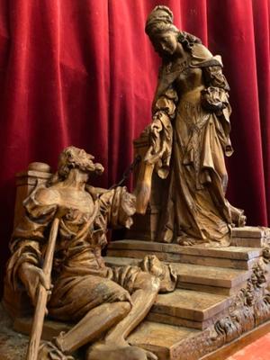 Wood Carved Statue Of Saint Elizabeth Giving A Coin With Her Right Hand To The Left Hand Of Beggar As Charity Gesture style Gothic - style en Hand - Carved Wood , Ortisei Sud Tirol Italy  20th century